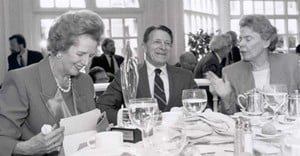 Margaret Thatcher, Caspar Weinberger, and Jeane Kirkpatrick share a light-hearted moment during the Freedom Flame luncheon.